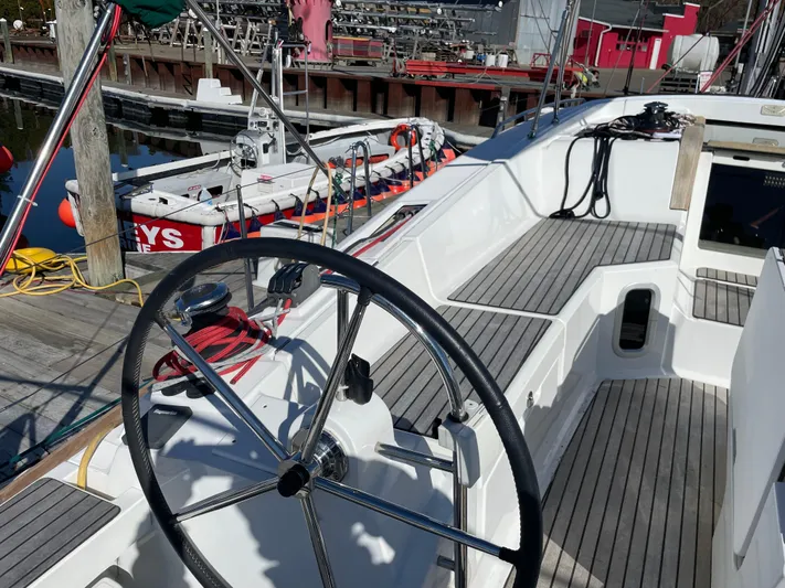 Life Line Yacht Photos Pics Sailboat Jeanneau Sun Odyssey 44 DS 2017, featuring a sleek deck and steering wheel.