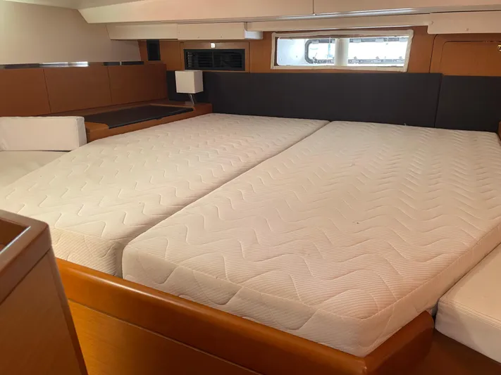 Life Line Yacht Photos Pics Luxurious cabin interior of 2017 Jeanneau Sun Odyssey 44 DS yacht with spacious bed.