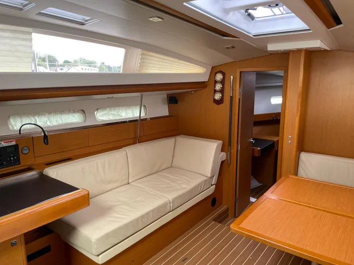 Life Line Yacht Photos Pics Interior of 2017 Jeanneau Sun Odyssey 44 DS yacht, featuring elegant wood finish and comfortable seating.