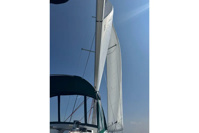 Life Line Yacht Photos Pics Sailing yacht Jeanneau Sun Odyssey 44 DS, 2017, with sails unfurled against a clear blue sky.