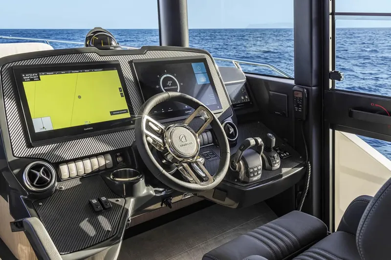  Yacht Photos Pics Cockpit of 2025 Absolute Navetta 53 yacht with advanced navigation systems and ocean view.