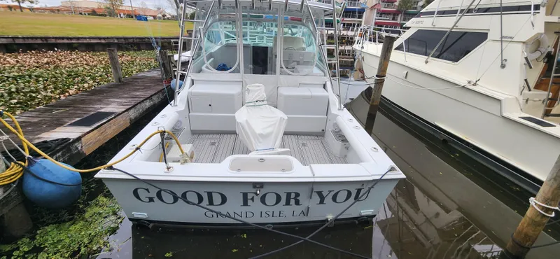 Re-fit 2021-2024 With 2017 Cummins 540s Yacht Photos Pics 1995 Cabo 35 Express boat docked, named "Good For You," Grand Isle, LA.