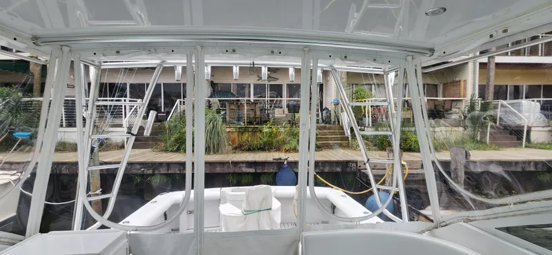 Re-fit 2021-2024 With 2017 Cummins 540s Yacht Photos Pics 1995 Cabo 35 Express boat interior with marina view.