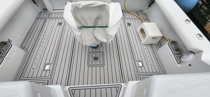 Re-fit 2021-2024 With 2017 Cummins 540s Yacht Photos Pics 1995 Cabo 35 Express boat deck with custom flooring and covered seat.