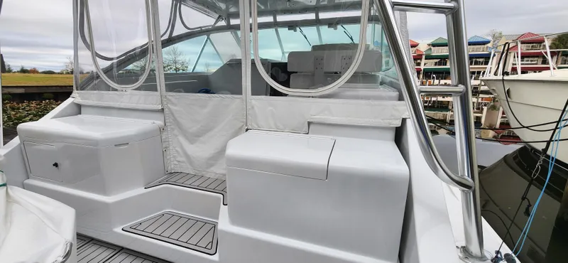 Re-fit 2021-2024 With 2017 Cummins 540s Yacht Photos Pics 1995 Cabo 35 Express boat with covered seating and marina background.