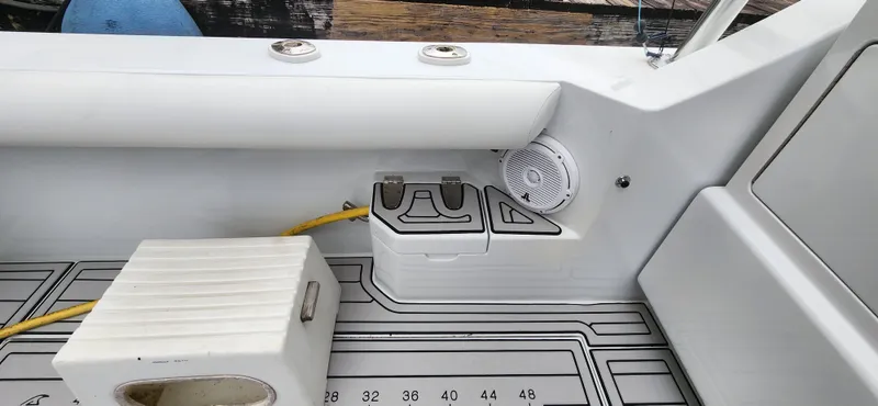 Re-fit 2021-2024 With 2017 Cummins 540s Yacht Photos Pics 1995 Cabo 35 Express boat interior with speaker and storage compartment.