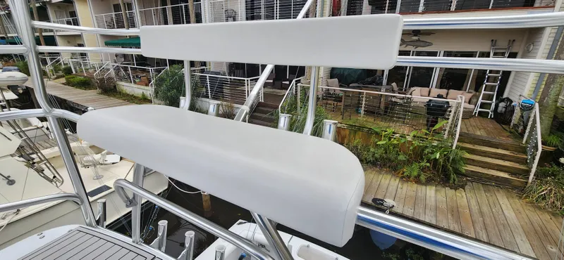 Re-fit 2021-2024 With 2017 Cummins 540s Yacht Photos Pics 1995 Cabo 35 Express boat with white seating on deck, dockside view.