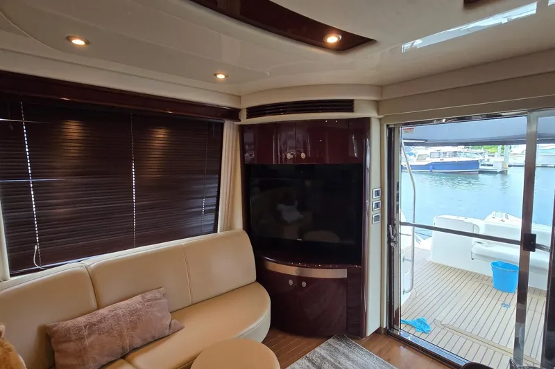  Yacht Photos Pics Luxurious interior of 2008 Sea Ray 58 Sedan Bridge yacht with waterfront view.