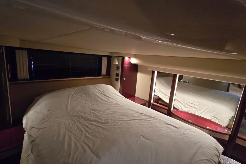  Yacht Photos Pics Luxurious bedroom interior of 2008 Sea Ray 58 Sedan Bridge yacht with cozy bedding.