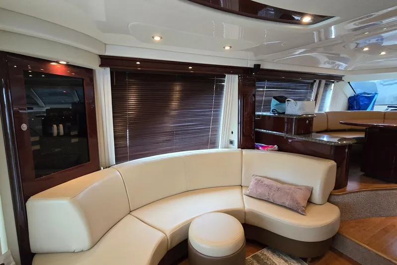  Yacht Photos Pics Luxurious interior of 2008 Sea Ray 58 Sedan Bridge yacht with elegant seating and wood accents.