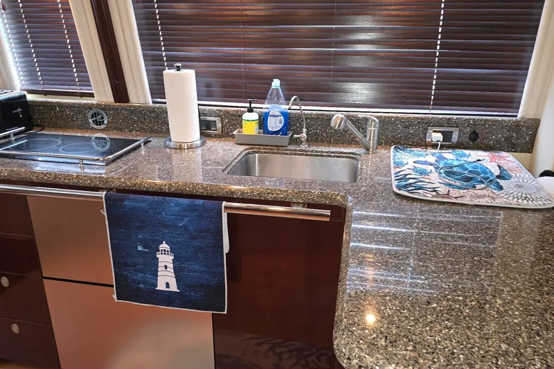  Yacht Photos Pics Luxurious kitchen area in a 2008 Sea Ray 58 Sedan Bridge yacht with granite countertops.