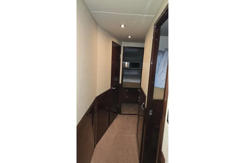  Yacht Photos Pics Hallway inside 2008 Sea Ray 58 Sedan Bridge yacht, featuring wood paneling and carpet.