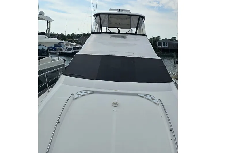  Yacht Photos Pics 2008 Sea Ray 58 Sedan Bridge yacht docked at marina, front view.