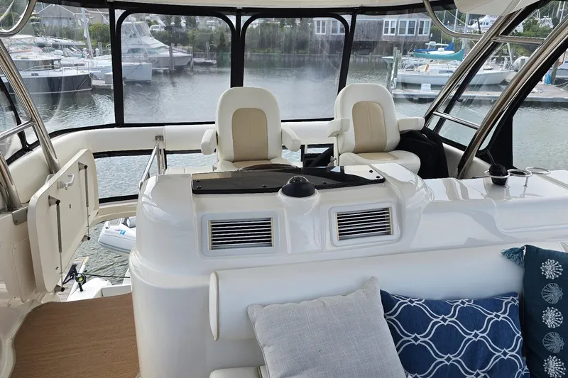 Yacht Photos Pics 2008 Sea Ray 58 Sedan Bridge yacht interior with helm and seating area.