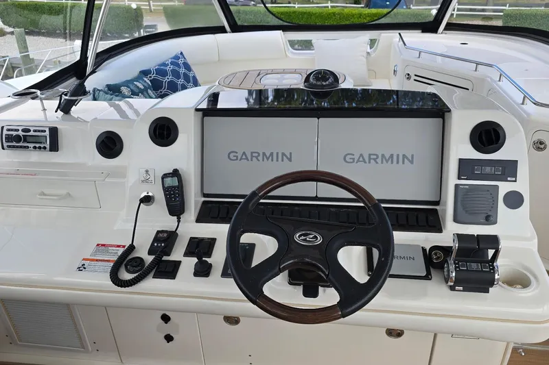  Yacht Photos Pics 2008 Sea Ray 58 Sedan Bridge helm with Garmin navigation displays and control panel.