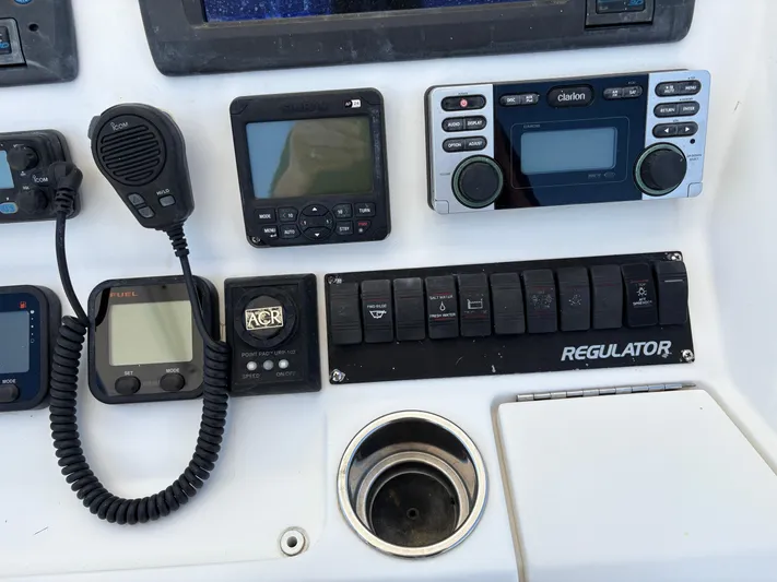  Yacht Photos Pics Control panel of a 2009 Regulator 32 Forward Seating boat with various electronic devices.