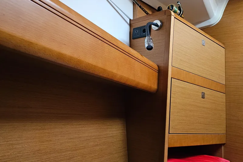 Tharos Yacht Photos Pics Interior of 2016 Jeanneau 379 sailboat with wooden cabinetry and modern design.