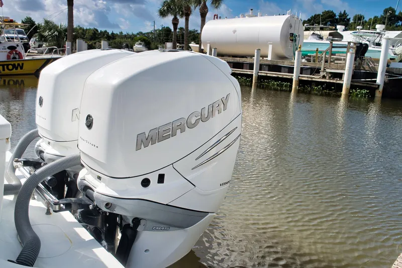  Yacht Photos Pics Twin Mercury outboard engines on a 2017 Yellowfin 32 Offshore boat docked by the water.