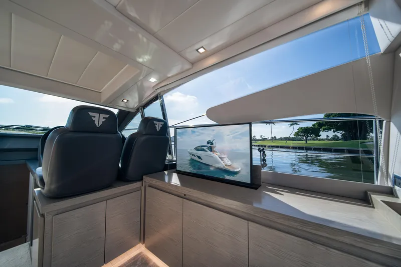 Juice Yacht Photos Pics Interior of 2019 Filippetti S55 yacht with luxury seating and scenic window view.