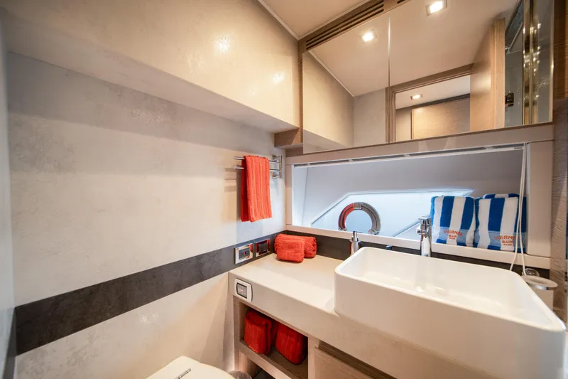 Juice Yacht Photos Pics Luxurious bathroom interior of 2019 Filippetti S55 yacht with modern sink and vibrant towels.