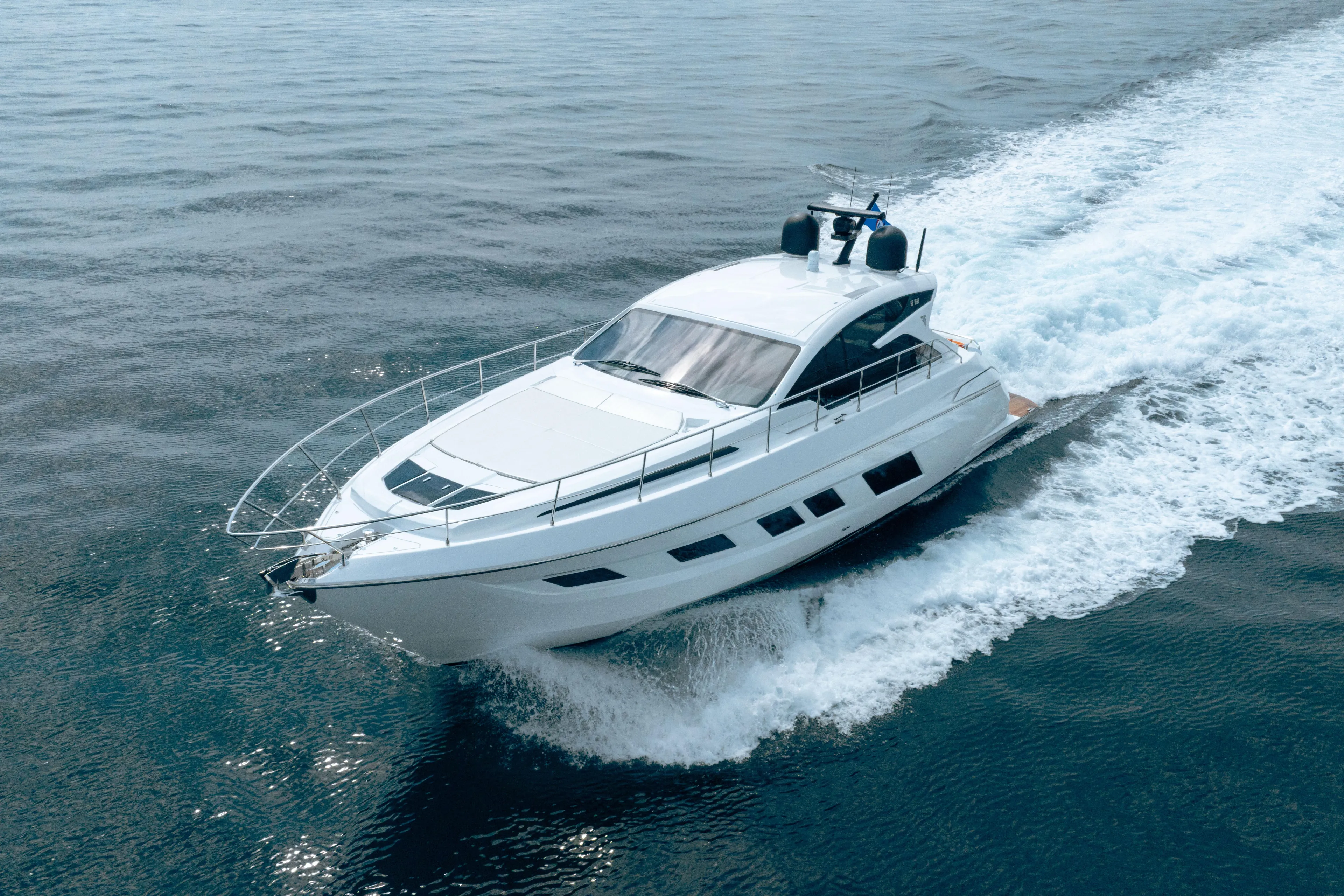 Juice Yacht Photos Pics 2019 Filippetti S55 yacht cruising on open water, showcasing sleek design and performance.