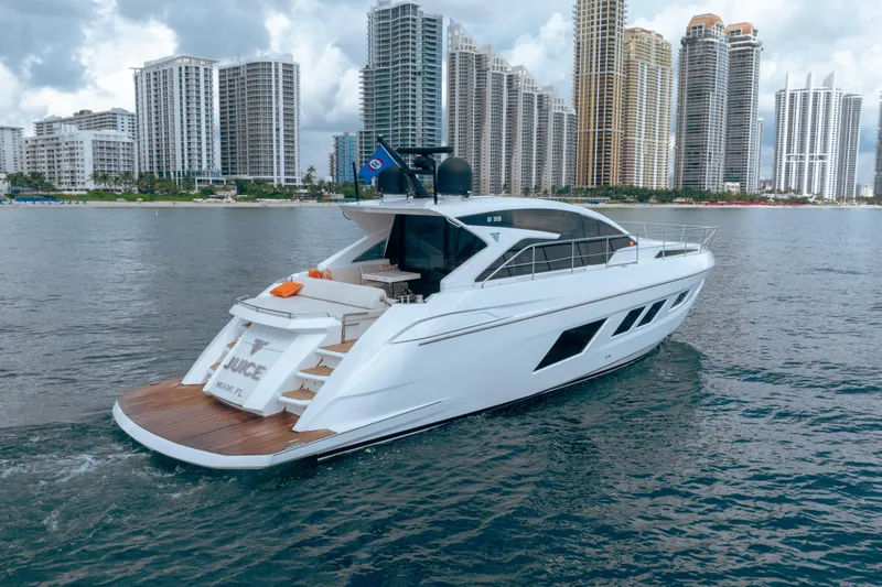Juice Yacht Photos Pics Luxurious 2019 Filippetti S55 yacht cruising near city skyline.