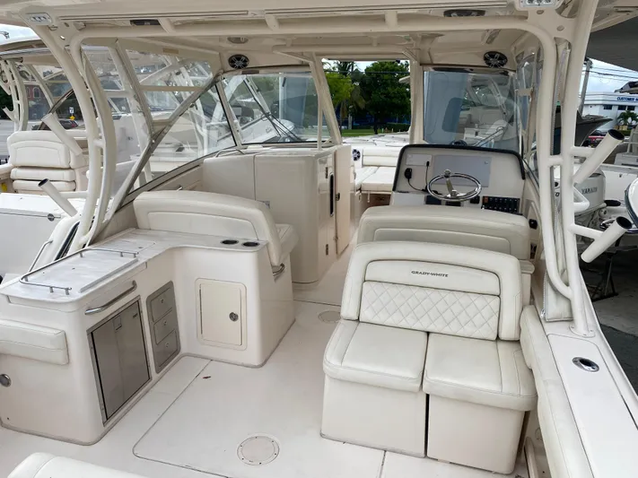  Yacht Photos Pics 2022 Grady-White Freedom 325 boat interior with luxurious seating and helm.