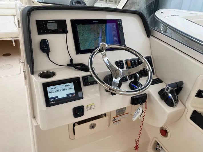  Yacht Photos Pics 2022 Grady-White Freedom 325 helm with advanced navigation and control systems.