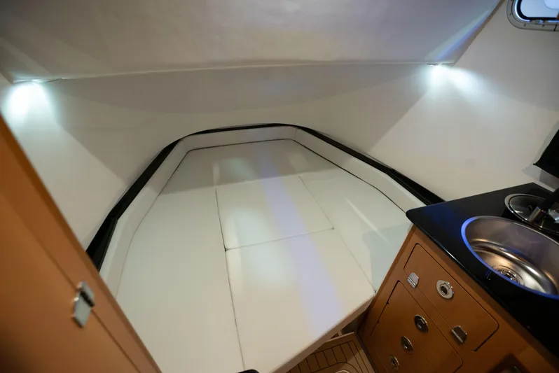 Yacht Photos Pics 2024 Victory V400 Open Sea cabin interior with bed and sink.