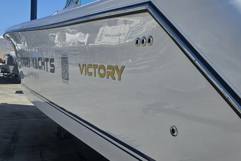  Yacht Photos Pics 2024 Victory Yachts V400 Open Sea, sleek design with reflective finish, docked outdoors.