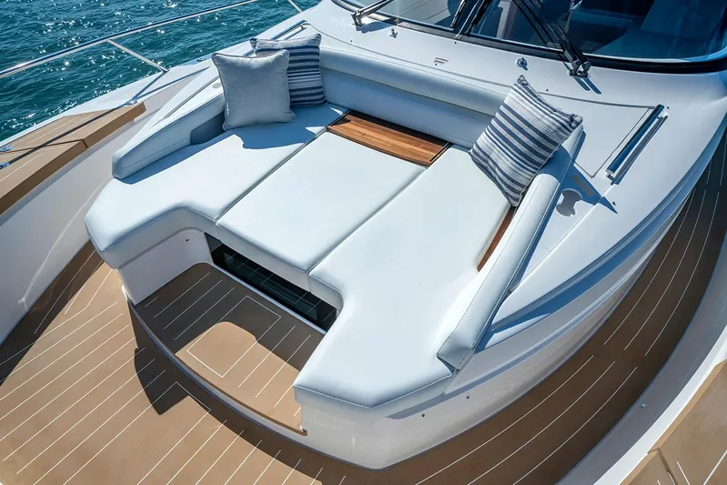 Jack's Boat Yacht Photos Pics Manufacturer Provided Image: Luxurious seating area on 2024 Tiara Yachts EX 60, featuring plush cushions and sleek design.