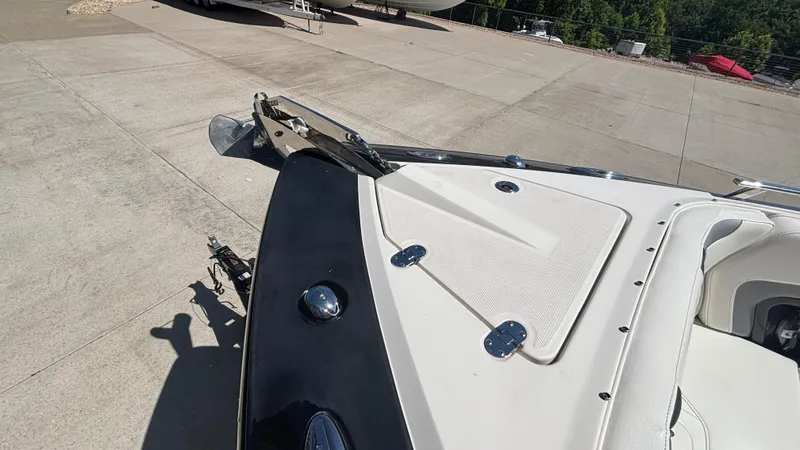  Yacht Photos Pics 2014 Monterey 328 Super Sport boat on a concrete surface, showing bow details.