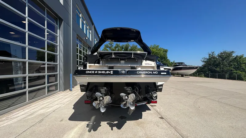  Yacht Photos Pics 2014 Monterey 328 Super Sport boat at a marina, rear view with dual propellers.