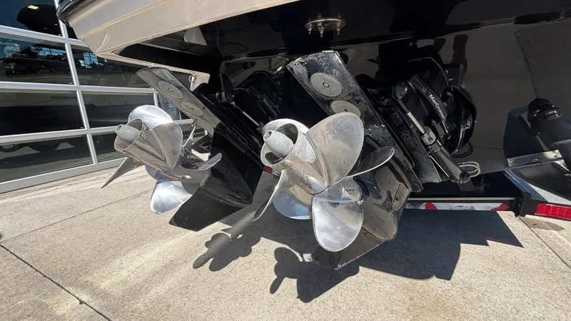  Yacht Photos Pics 2014 Monterey 328 Super Sport boat propellers and stern drive in a showroom.