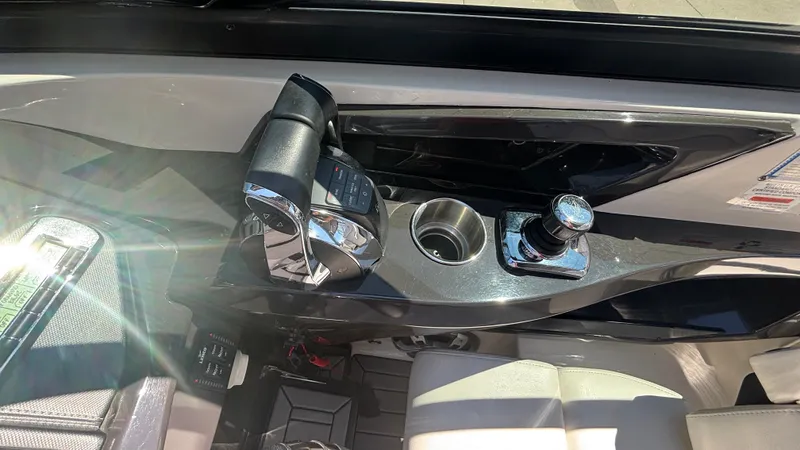  Yacht Photos Pics Control panel of a 2014 Monterey 328 Super Sport boat with throttle and joystick.