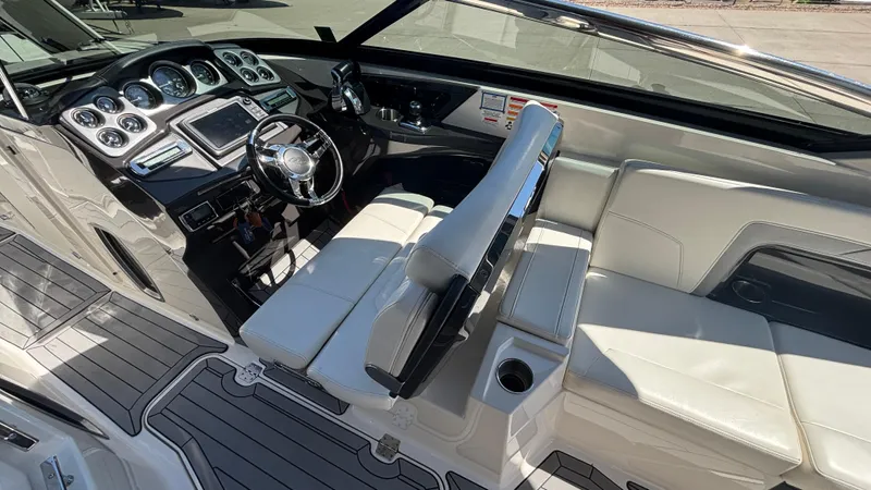  Yacht Photos Pics 2014 Monterey 328 Super Sport boat interior with sleek dashboard and white seating.