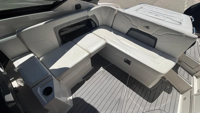  Yacht Photos Pics Luxurious seating area on a 2014 Monterey 328 Super Sport boat with white upholstery.