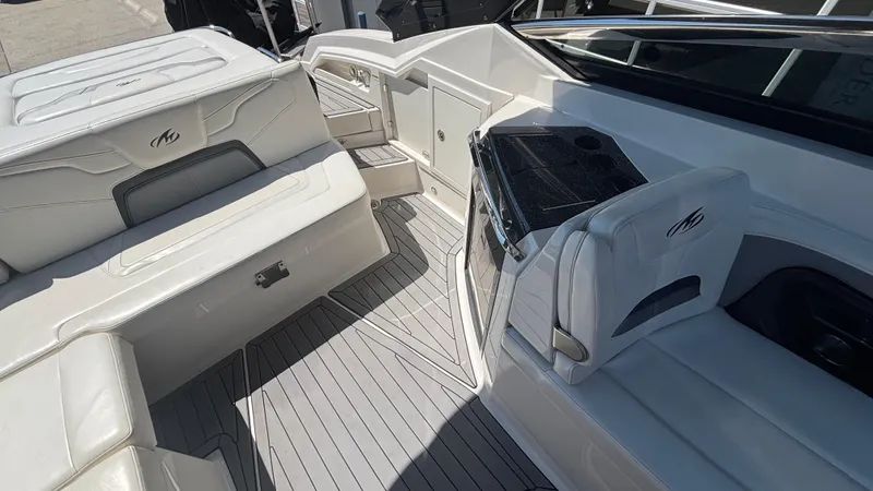  Yacht Photos Pics 2014 Monterey 328 Super Sport boat interior with white seating and sleek design.