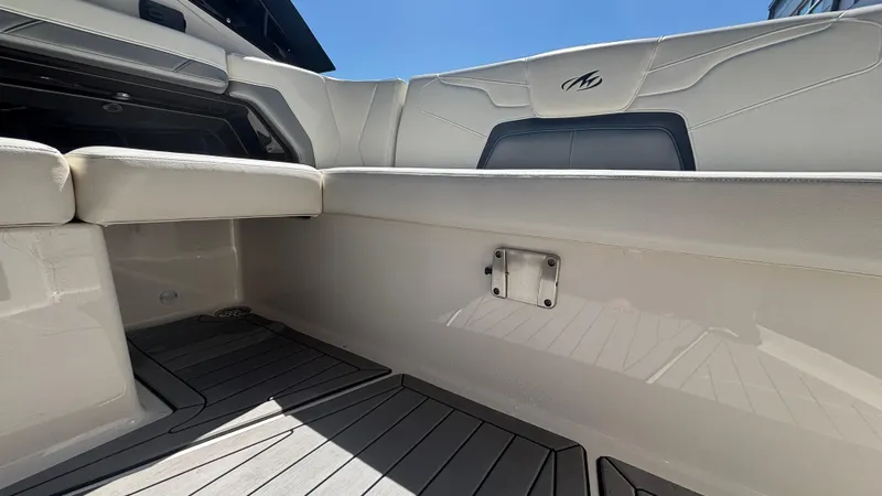  Yacht Photos Pics Interior view of a 2014 Monterey 328 Super Sport boat with white seating and sleek design.