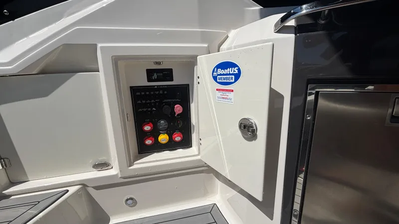  Yacht Photos Pics 2014 Monterey 328 Super Sport boat control panel with BoatUS Member sticker.