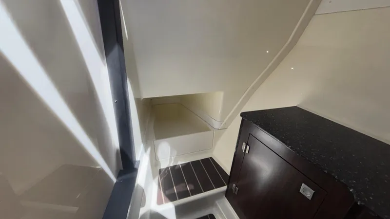  Yacht Photos Pics Interior of 2014 Monterey 328 Super Sport boat, featuring sleek cabinetry and modern design.