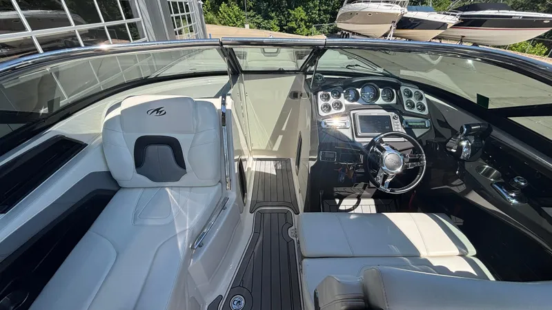  Yacht Photos Pics 2014 Monterey 328 Super Sport boat interior with sleek dashboard and luxurious seating.