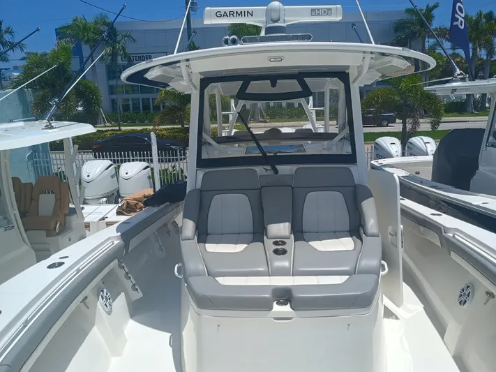 41-083 Yacht Photos Pics 2023 Regulator 41 boat interior with seating, Garmin equipment, and outboard motors.