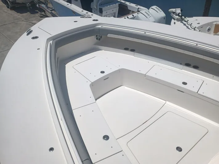 41-083 Yacht Photos Pics 2023 Regulator 41 boat deck with storage compartments and seating area.