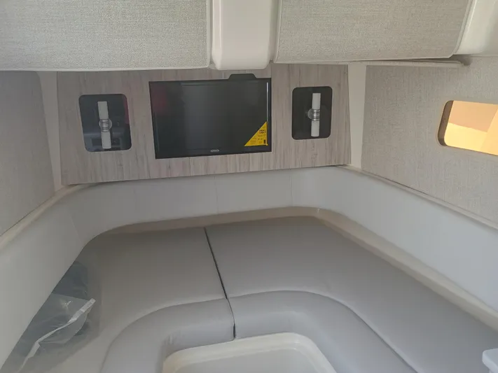 41-083 Yacht Photos Pics 2023 Regulator 41 boat interior with TV and seating area.