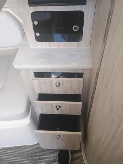 41-083 Yacht Photos Pics 2023 Regulator 41 interior with open drawers and modern cabinetry.