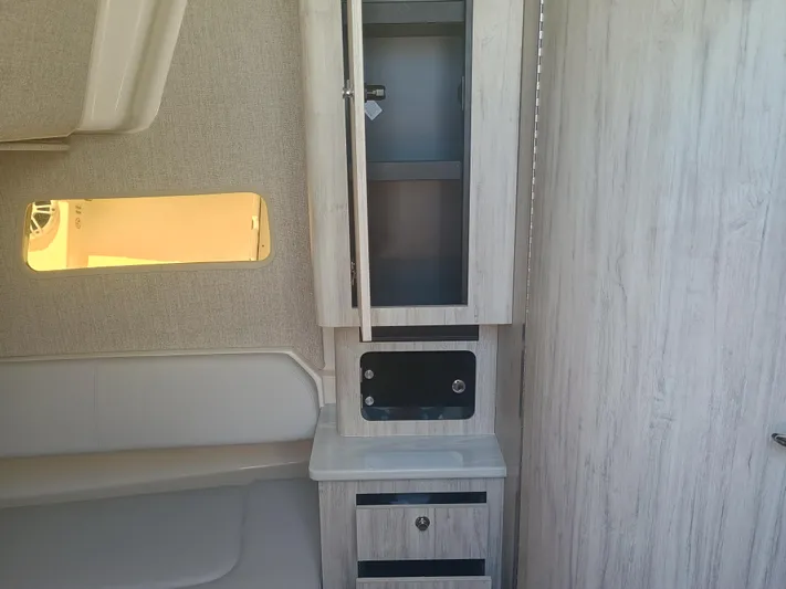 41-083 Yacht Photos Pics Interior of 2023 Regulator 41 boat with modern cabinetry and seating.