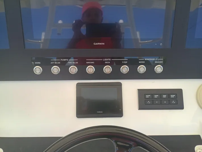 41-083 Yacht Photos Pics Control panel of 2023 Regulator 41 boat with Garmin display and various switches.