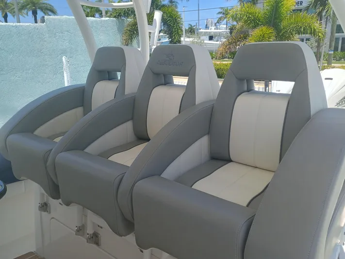 41-083 Yacht Photos Pics 2023 Regulator 41 boat seats, gray and white, luxurious design, outdoor setting.