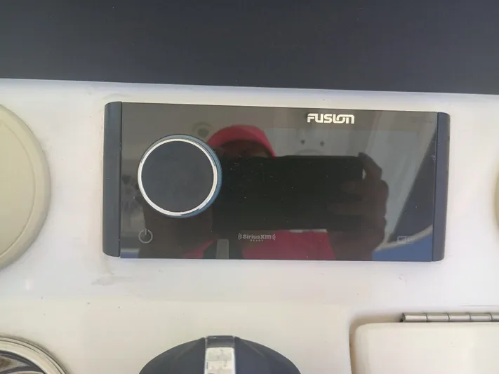 41-083 Yacht Photos Pics Fusion audio system on 2023 Regulator 41 boat dashboard.